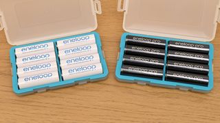 Eneloop rechargeable AA batteries in boxes on a table